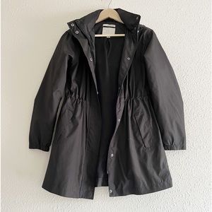 a new day black rain jacket